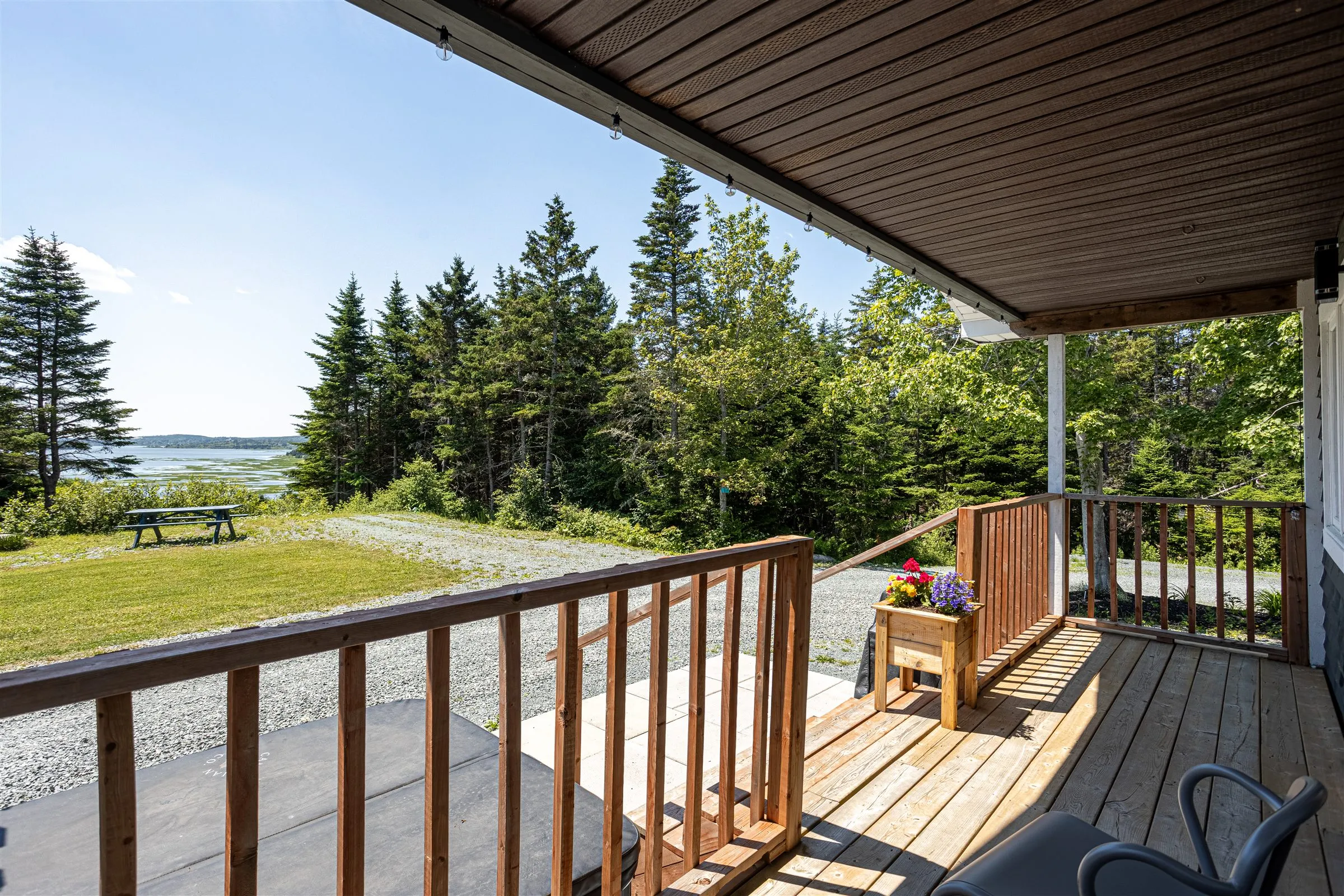 The view from the cabin deck across the lawn to Chezzetcook Inlet.