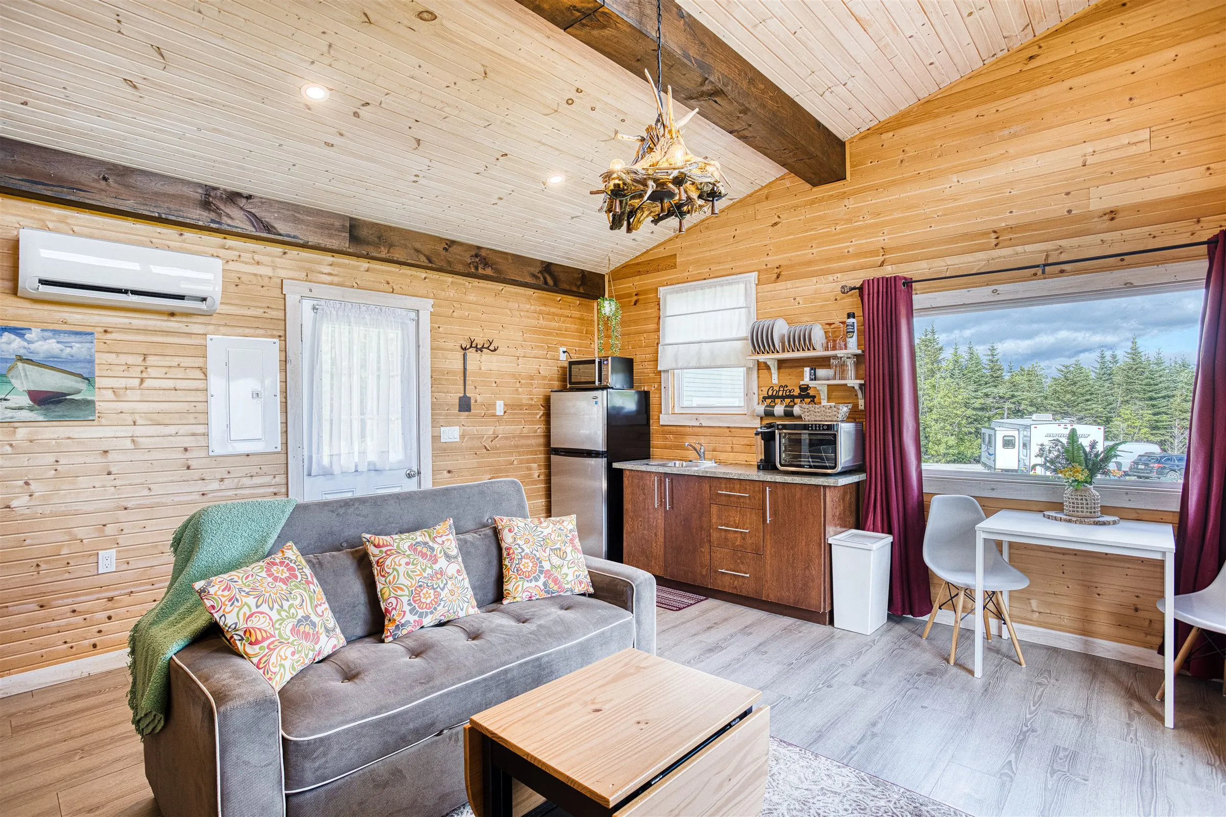 The kitchenette and a large picture window in the sitting area.